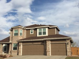 Tan Brick House with Brown Paint