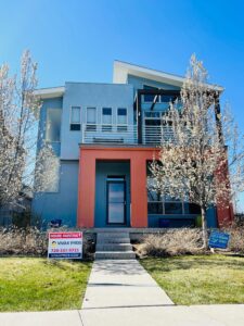 contemporary home with new burnt orange and baby blue paint Vivax Pros House Painters